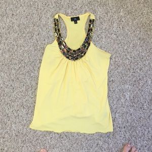 Sleeveless beaded neck shirt